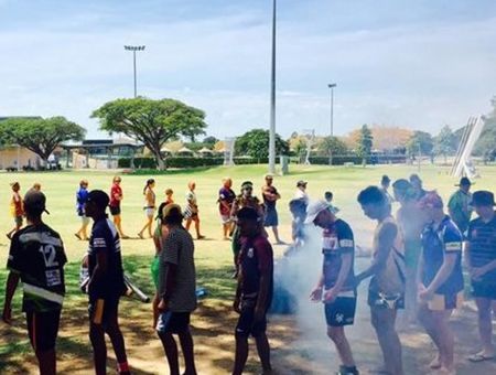 Aboriginal youths in playing field