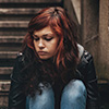 A girl looking down at the ground